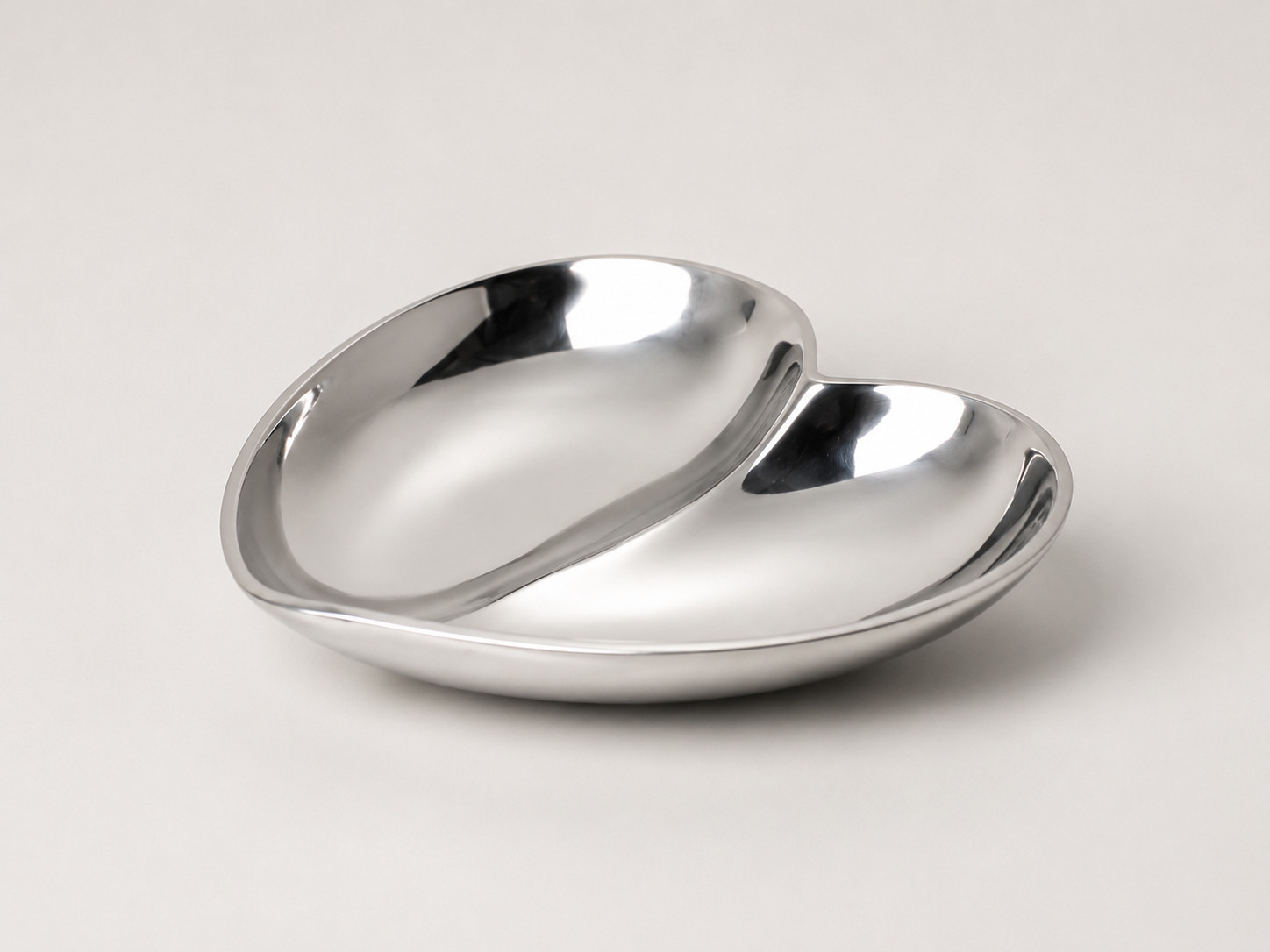 Polished double-compartment metal serving dish